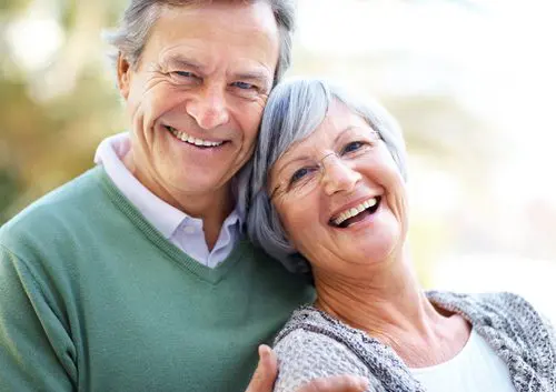 Closeup portrait of happy mature couple enjoying together - Outdoor
