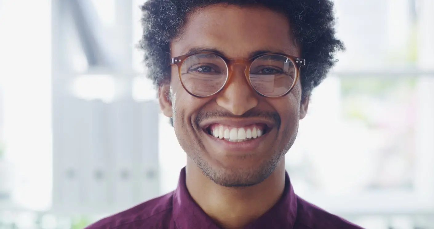 Portrait of a confident young businessman working in a modern office