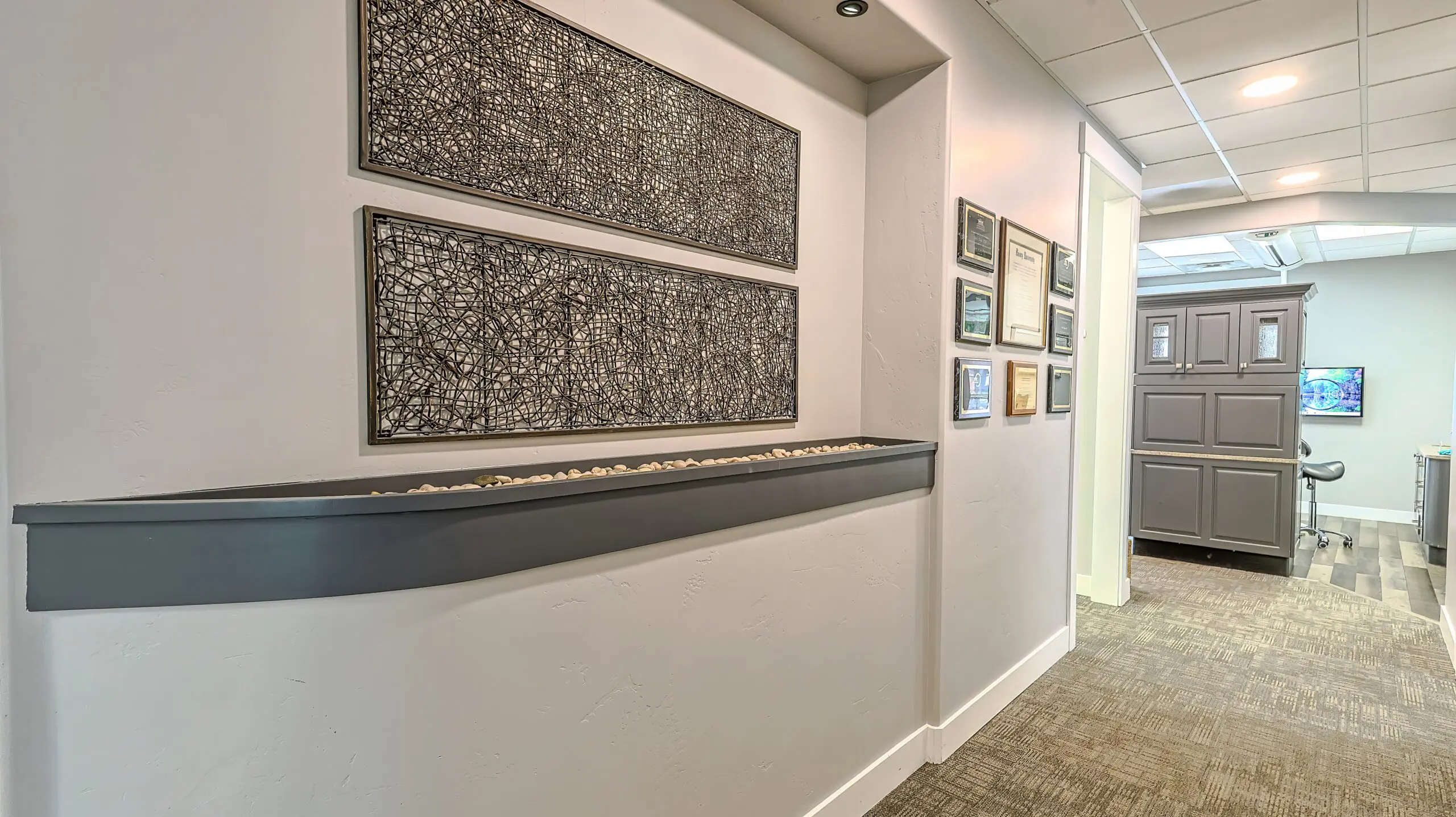 Hallway with framed dental certificates
